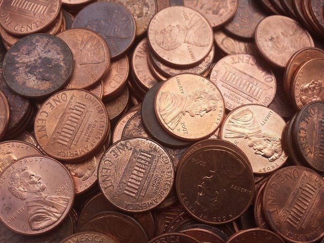 A pile of pennies, some old and dark, some new and shiny.